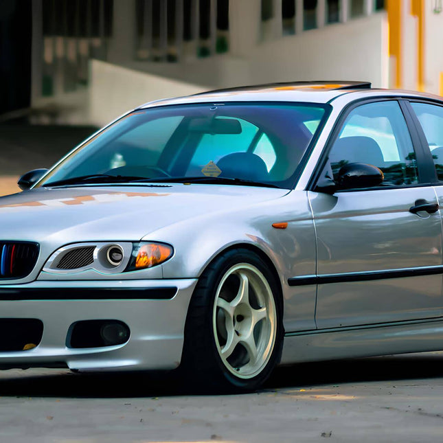 BMW E46 carbon fiber hood, lightweight racing hood, E46 M3 carbon fiber bonnet, BMW 330i performance hood upgrade, 325i track-ready hood, weight reduction mod, aerodynamics enhancement, aggressive styling, race-spec body modification.