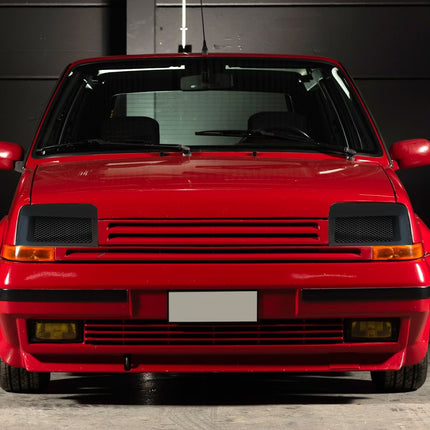 Renault 5 GT Turbo carbon fiber rear bumper diffuser engineered to improve aerodynamics and add an aggressive racing look. Lightweight and durable, this upgrade enhances airflow under the car and gives your Renault 5 a bold motorsport-inspired design.