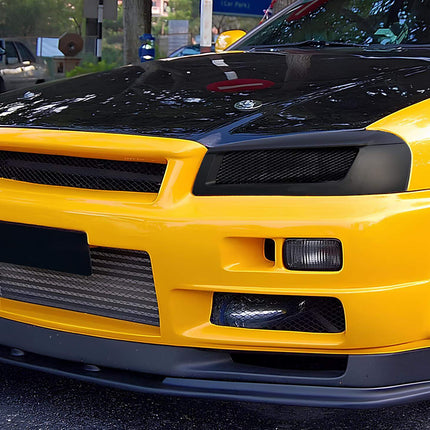 Nissan Skyline R34 fully adjustable coilover suspension, height and dampening control, camber tuning, track-spec spring rates, race-proven cornering stability.

