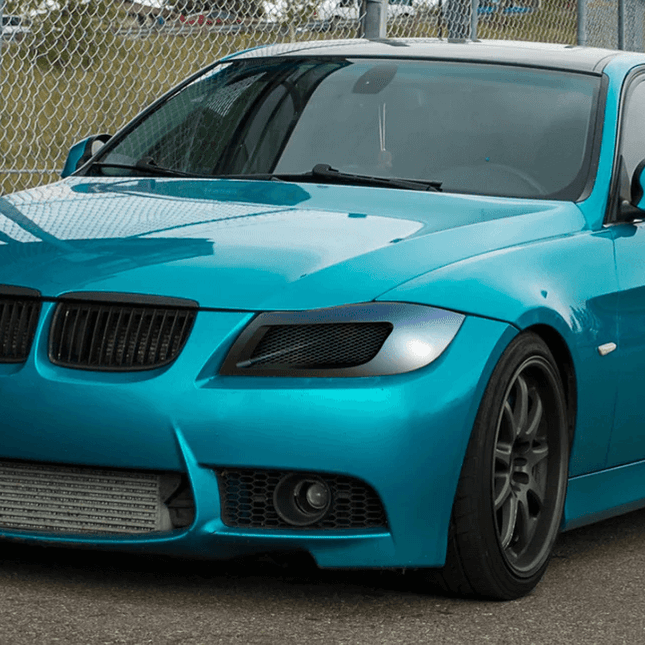 BMW E90 carbon fiber rear trunk lip, M3-style spoiler upgrade, 335i aerodynamic rear lip, E90 track-spec trunk lid extension, BMW 328i aggressive styling upgrade, lightweight carbon trunk lip, race-ready rear-end enhancement.


