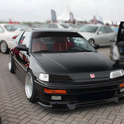 Honda Civic EE9, EF9, SiR, CRX EE8, EF8 VTEC body kit, JDM-style bumper, side skirts, rear diffuser, carbon fiber hood, widebody kit, front lip, fender flares, grille, hood vents, aggressive aerodynamics, lightweight body panels, race-inspired styling.

