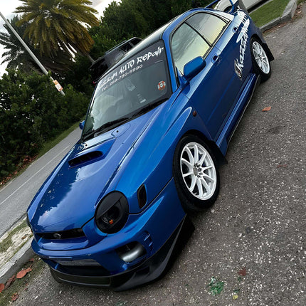 2002-2003 Subaru WRX cold air intake system, high-flow air filter, carbon fiber intake pipe, optimized throttle response, increased airflow efficiency, aggressive induction sound.

