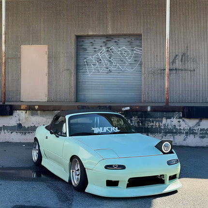 Strut tower brace for Mazda Miata 1990-1997 increases chassis rigidity and improves cornering control.