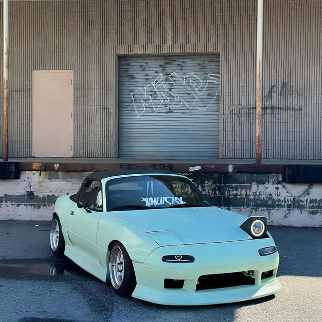 Strut tower brace for Mazda Miata 1990-1997 increases chassis rigidity and improves cornering control.