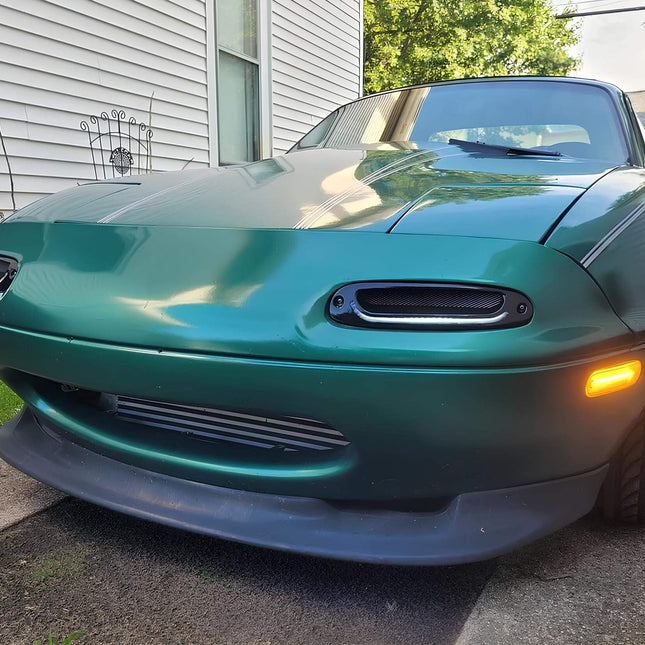 Mazda Miata MX-5 NA Roadster JDM-style turn signals, high-powered LED bumper-mounted indicators, sequential flashing amber lights, stylish clear or smoked lens upgrade, track-ready road safety.

