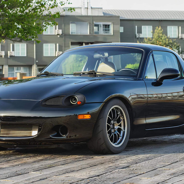 Miata MX-5 NB2 LED headlights, projector retrofit, smoked lenses, JDM-style black housing, daytime running lights, high-output illumination, modern styling, enhanced night visibility, HID upgrade.

