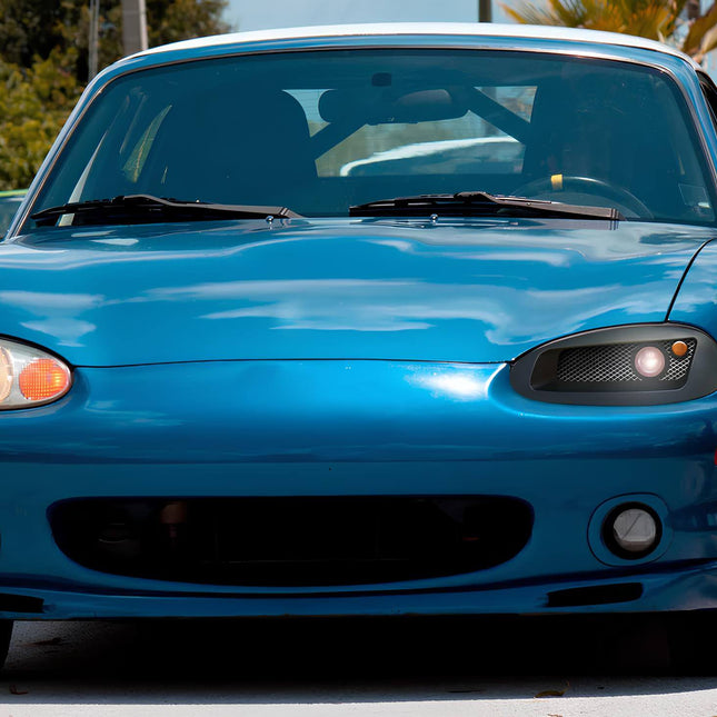 Mazda Miata MX-5 NB2 titanium lug nuts, lightweight forged alloy wheels, deep dish concave rims, aggressive stance, high-performance tire fitment, staggered setup, JDM-style wheel package, track-ready durability, race-ready grip.

