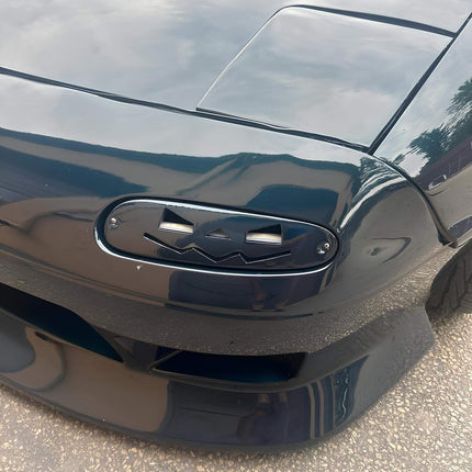 Mazda Miata MX-5 NA Roadster carbon fiber hood, vented race hood, lightweight construction, heat dissipation, track-spec aerodynamics, high-performance weight reduction, aggressive styling, JDM-style fitment.

