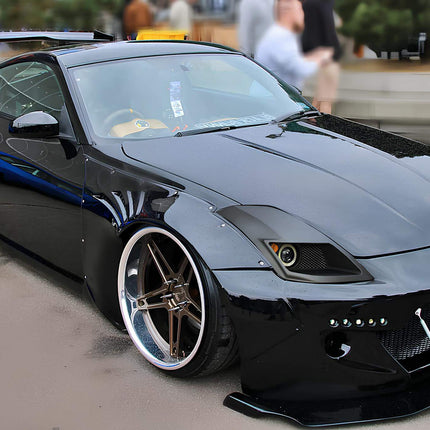 Nissan 350Z big brake kit, lightweight multi-piston calipers, drilled and slotted rotors, high-friction ceramic pads, stainless steel brake lines, track-proven stopping power.

