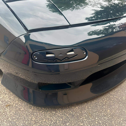 Mazda Miata MX-5 NA Roadster front splitter, carbon fiber aerodynamic upgrade, wind tunnel-tested airflow improvement, increased downforce, track-spec handling, aggressive front-end modification.

