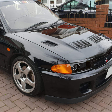 Mitsubishi Evolution 1, 2, 3 upgraded camshaft kit, titanium valve springs, high-lift camshafts, adjustable cam gears, dyno-tuned power gains, race-ready engine modification, high-RPM performance tuning.

