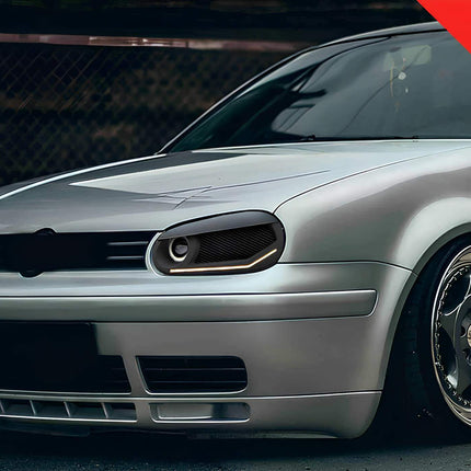 Golf Mk4 headlight intake vent, race-ready cold air funnel, improved engine cooling, drag-reducing headlight vent, turbo induction system, high-flow air channel, aftermarket lightweight headlamp intake, optimized forced induction airflow.

