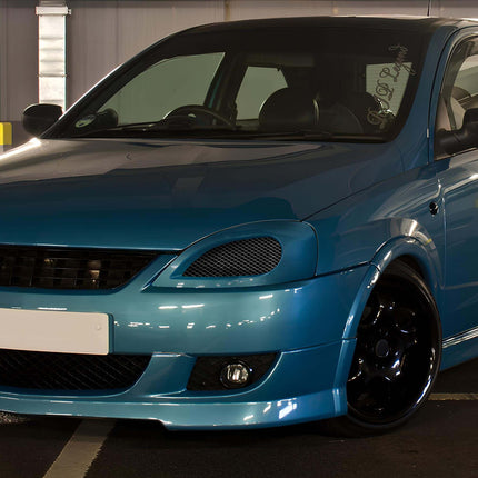 "A track-prepped Holden Barina featuring a roll cage, wide tires, and a turbocharged engine upgrade."