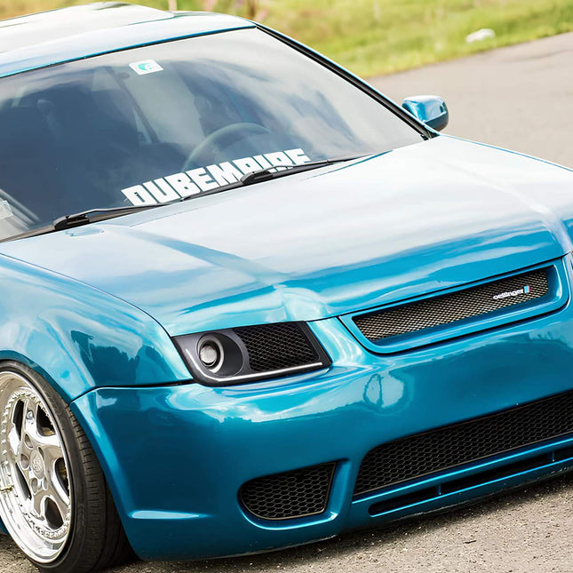 Jetta MK4 racing big brake kit, lightweight drilled and slotted rotors, multi-piston calipers, improved braking force, high-performance brake pads.

