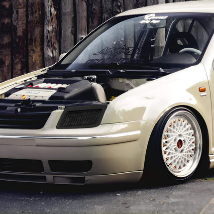 Volkswagen Jetta MK4 fully adjustable coilover suspension, race-spec damping control, improved ride height tuning, track-ready suspension stability, aggressive stance setup.

