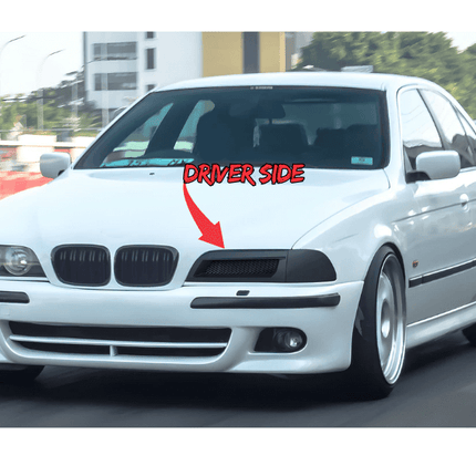 Interior shot focusing on the BMW E39's leather seats with contrasting piping, showcasing the luxurious materials and craftsmanship that define the cabin's upscale ambiance.

