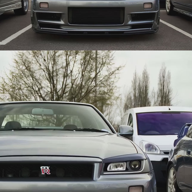Nissan Skyline R34 high-performance vented front bumper, wind tunnel-tested aerodynamics, track-optimized airflow management, aggressive styling, lightweight fiberglass construction.

