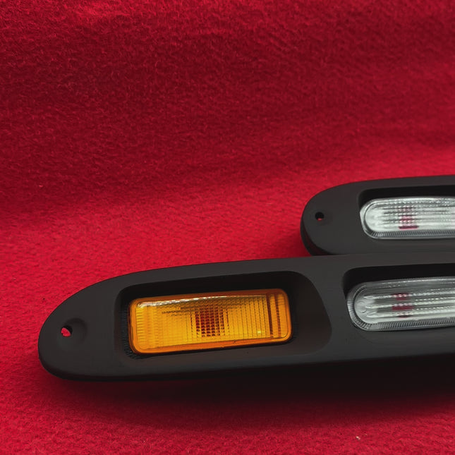 Mazda Miata MX-5 NA Roadster OEM-style front bumper turn signal kit, LED conversion, bright amber flashers, high-performance road safety enhancement, sleek JDM aesthetic, plug-and-play replacement.

