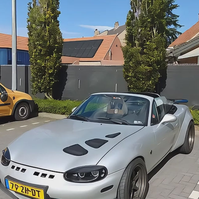 Miata MX-5 NB1 titanium wheel lug nuts, lightweight forged alloy wheels, concave rims, JDM-spec offset, 15-inch, 16-inch staggered fitment, high-performance tires, aggressive track setup, enhanced cornering grip.

